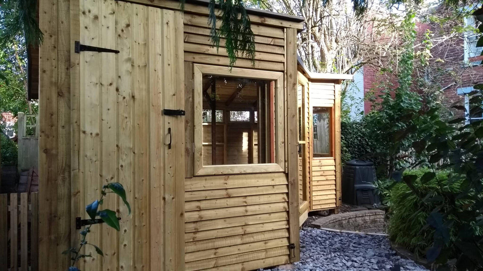Side view of the summer house showing storage room door