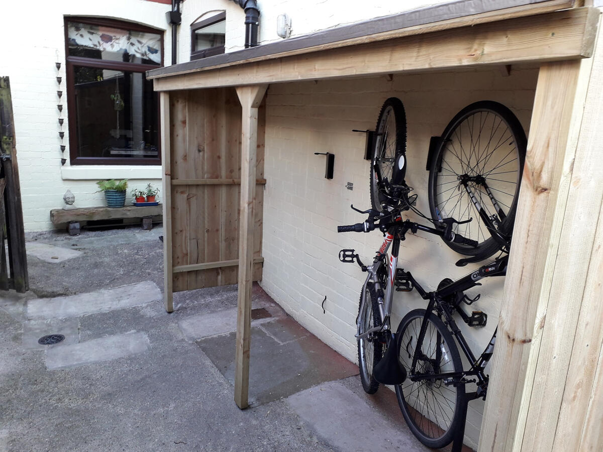 The custom bike storage uses fold away brackets to maximise space