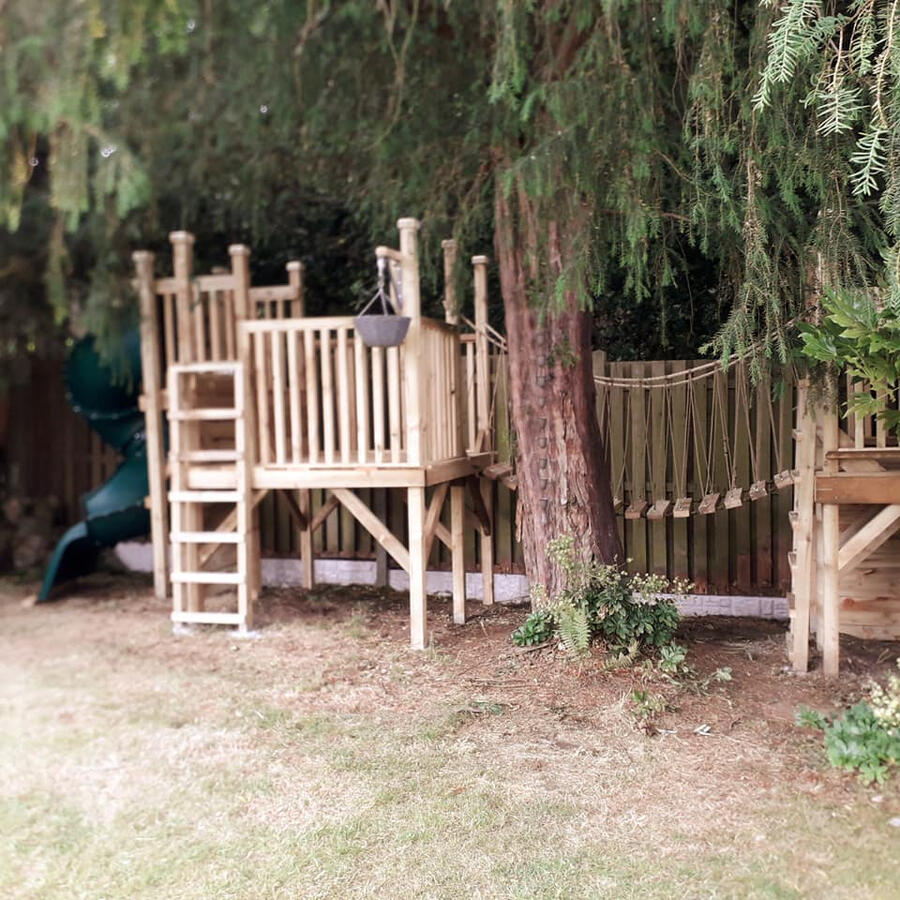 The treehouse is build around existing trees