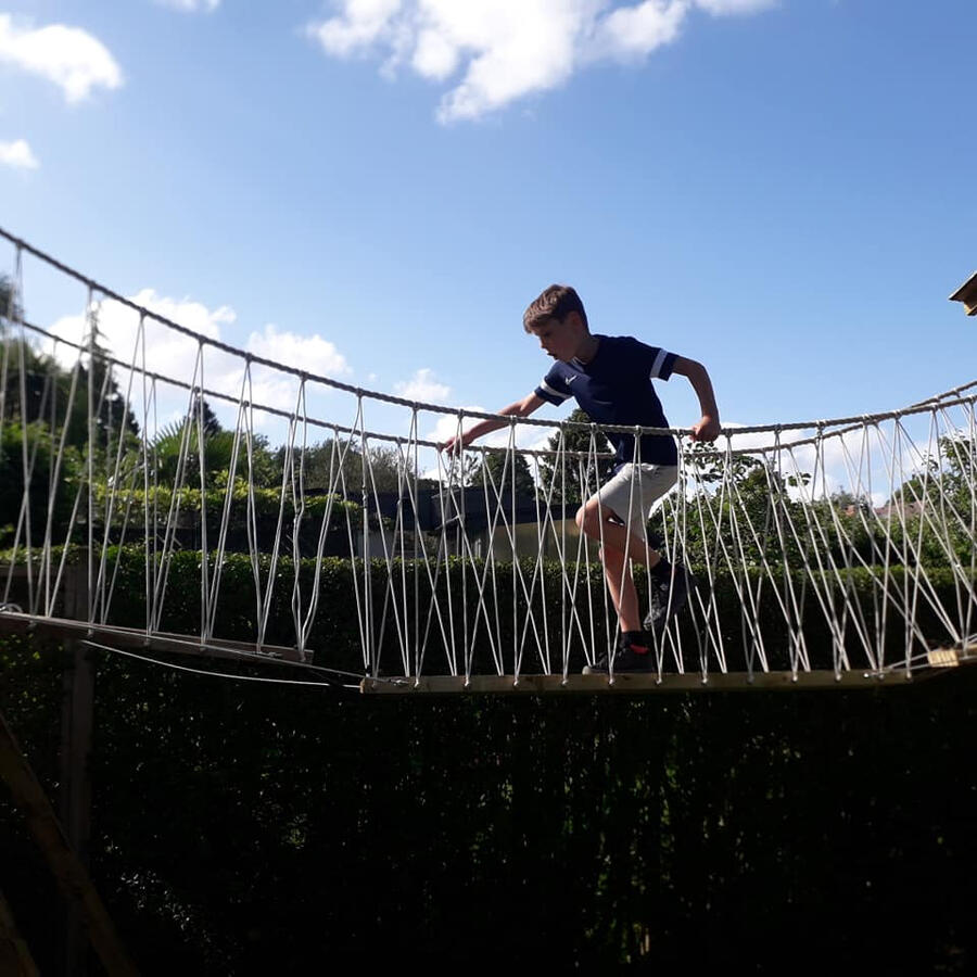 Handmande rope bridge in use